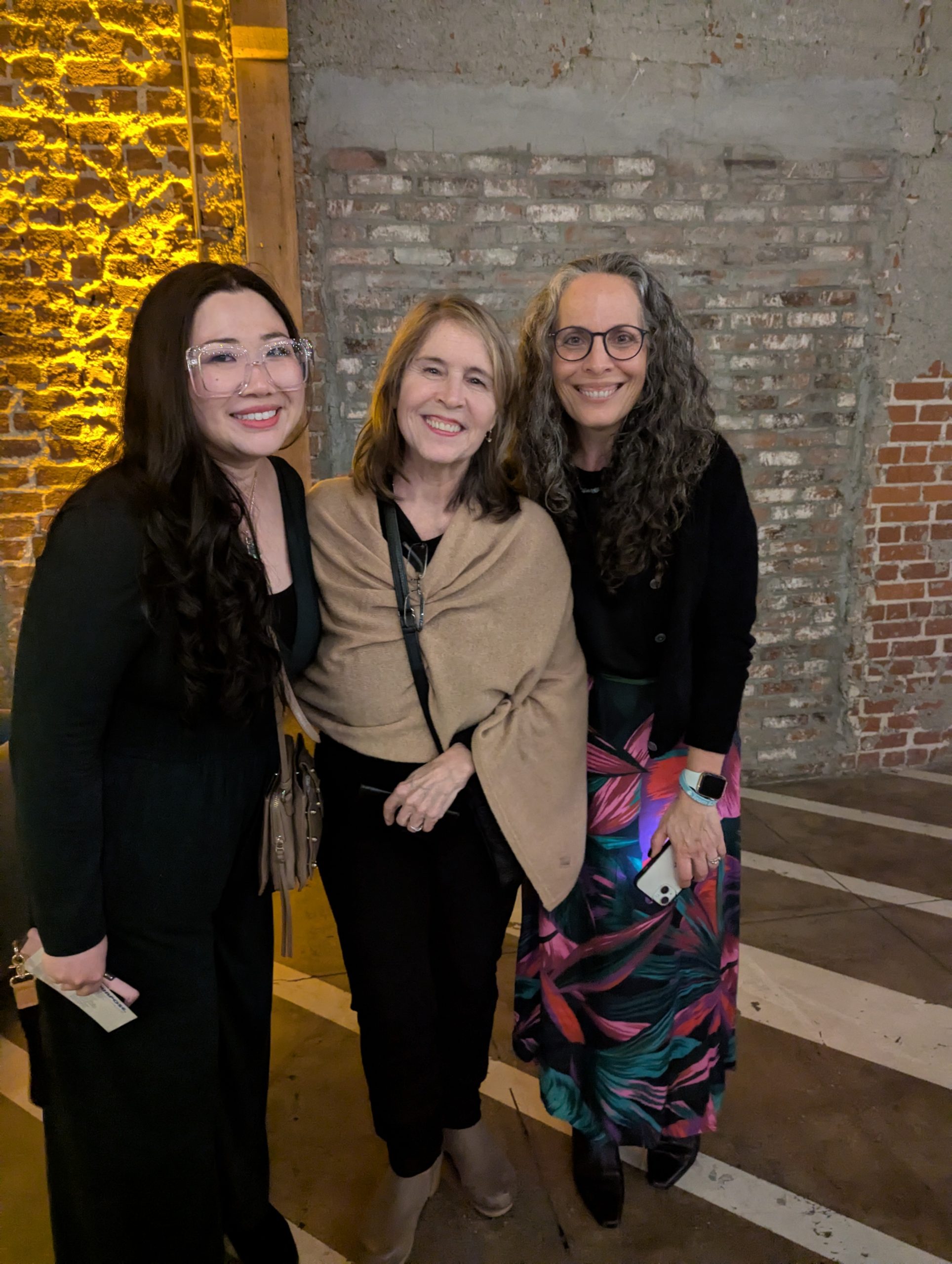 Jenny Qi, Sarah Carey and Catherine Prescott pose for a photo before the Off Site. On Purpose reading at MG Studio on March 27, 2024 in L.A.