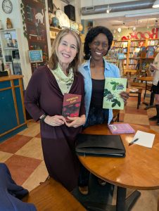 Got in a good pre-reading visit with Mildred Barya. and we signed each others' books.
